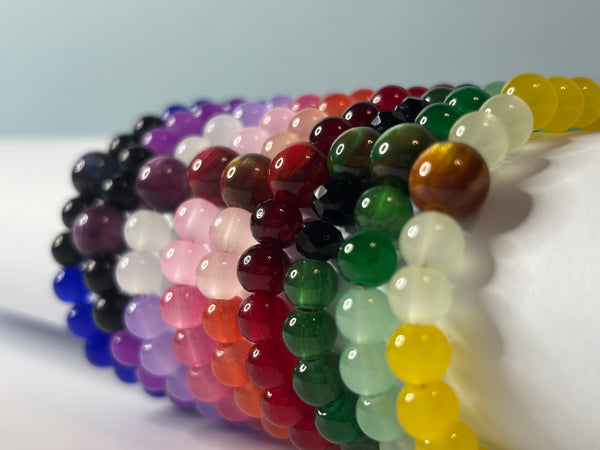 Colorful beaded bracelets arranged in a row