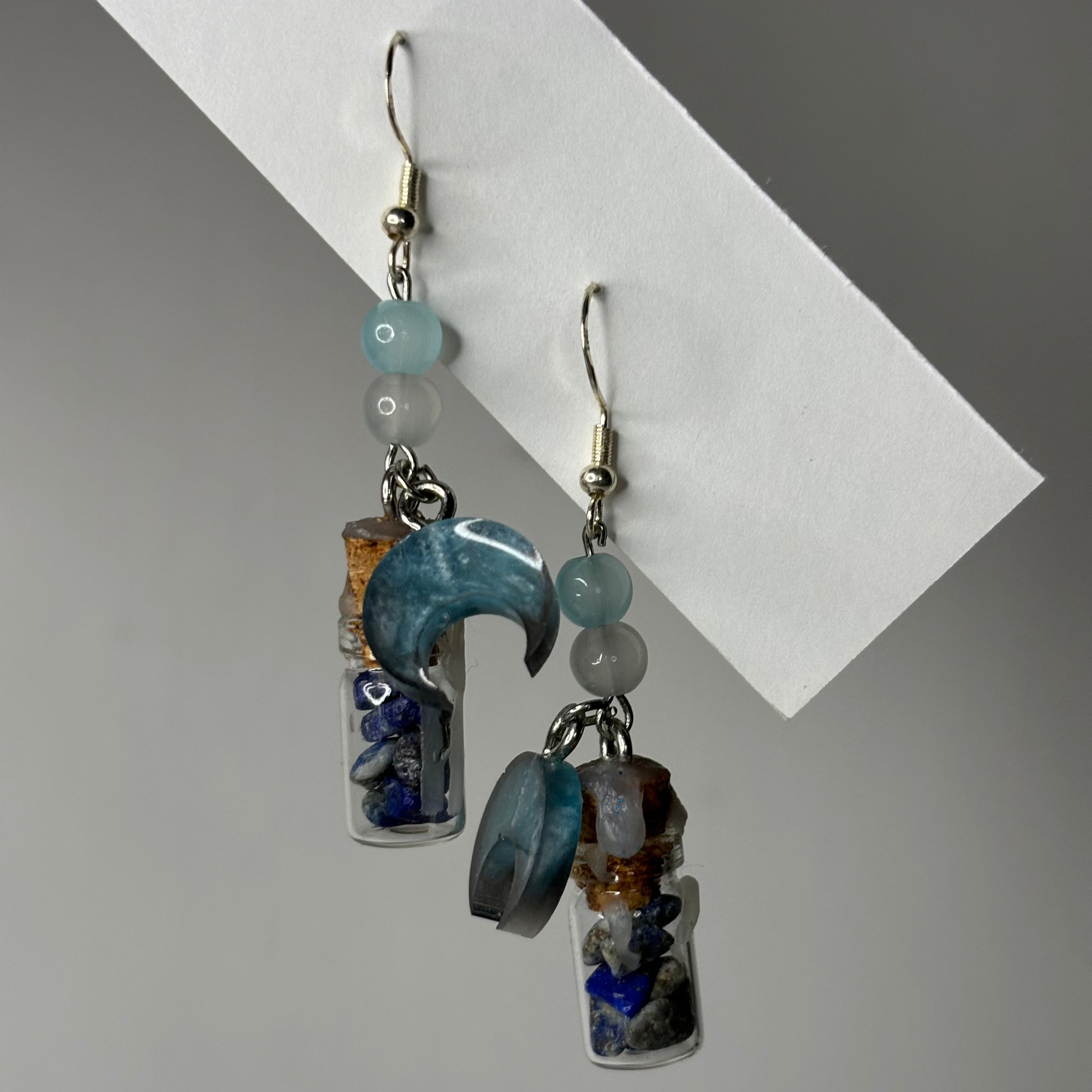 Cosmos-colored dangle earrings from the Crystal Elixir Collection