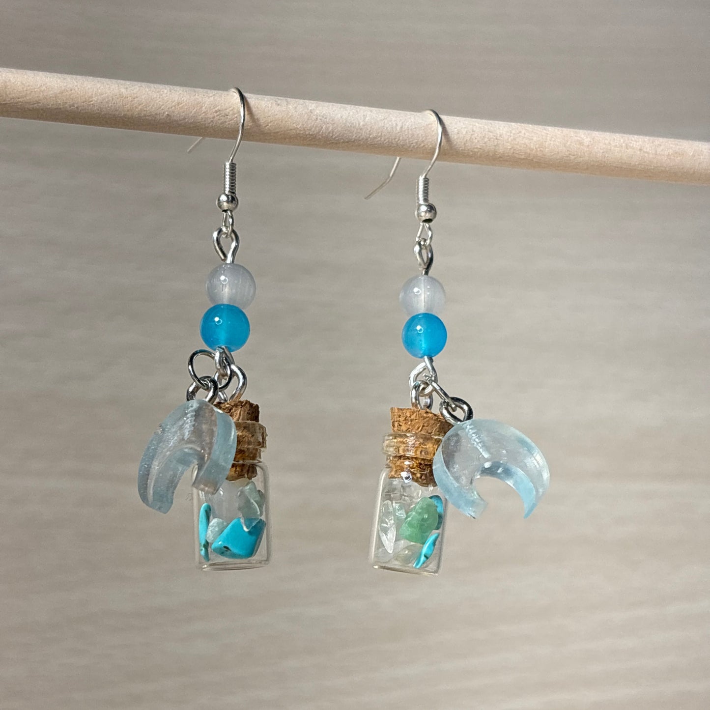 Iceberg-colored dangle earrings from the crystal elixir collection