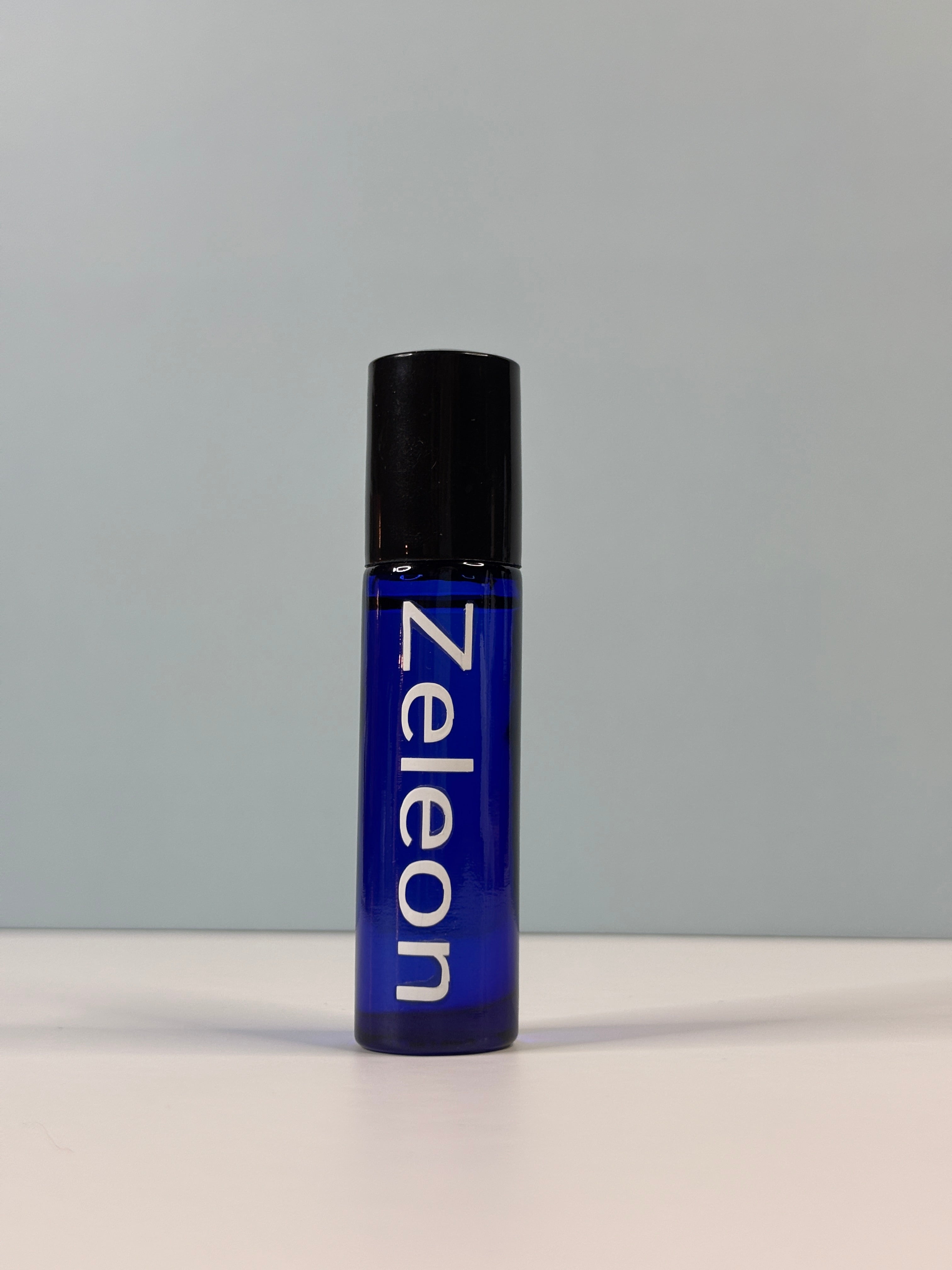 Zeleon perfume on a gray background